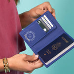 Leather RFID Passport Wallet in blue, open, showing card slots and passport