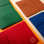 Leather RFID Passport Wallet in blue, red, green and tan