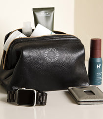 Leather Toiletry Bag in black, showing logo placement