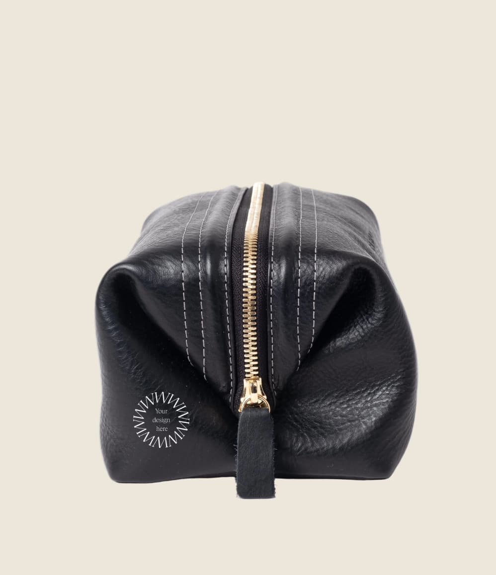 Leather Toiletry Bag in black, side view, zip closed