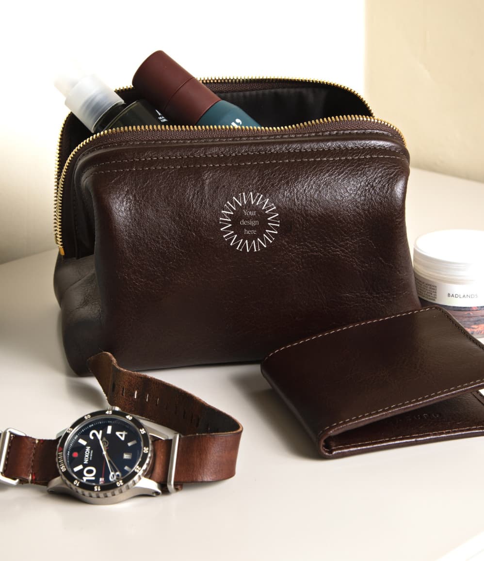 Leather Toiletry Bag in brown, showing logo placement
