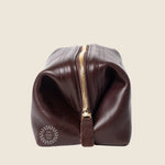 Leather Toiletry Bag in black, side view, zip closed