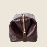 Leather Toiletry Bag in black, side view, zip closed