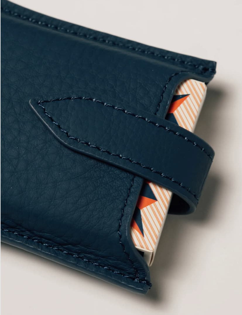 Blue leather travel playing cards set with magnetic closure, a personalised corporate gift from women-owned brands.