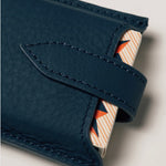 Blue leather travel playing cards set with magnetic closure, a personalised corporate gift from women-owned brands.