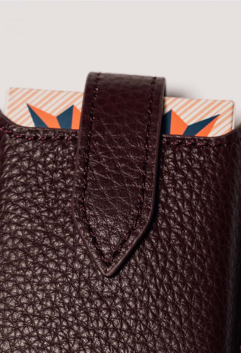 Burgundy leather travel playing cards set, a premium corporate gift for executive teams and brand activations.