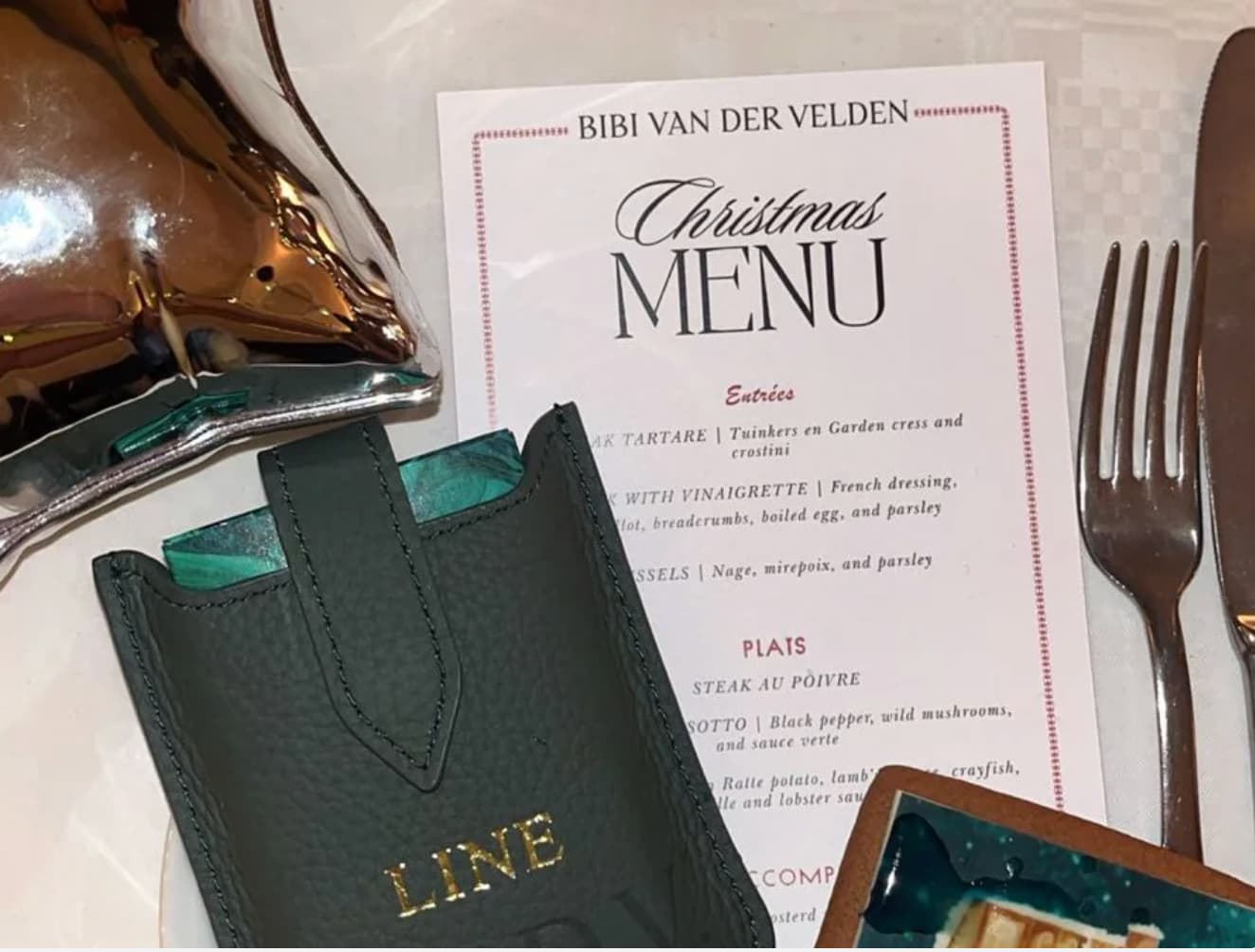 Leather travel playing cards set in use, showing cards, dice and notebook, a sustainable corporate gift for client and employees appreciating gifting