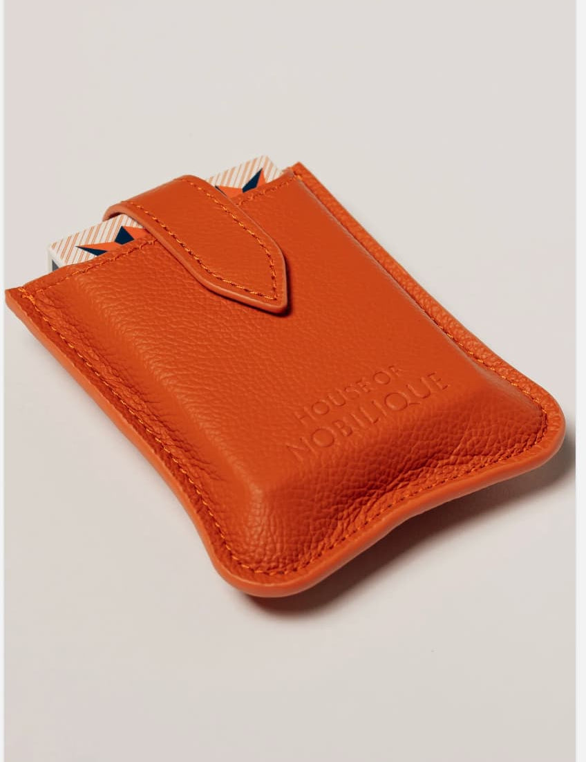 Orange leather travel playing cards set, a branded corporate gift designed for events, offsites and travel.