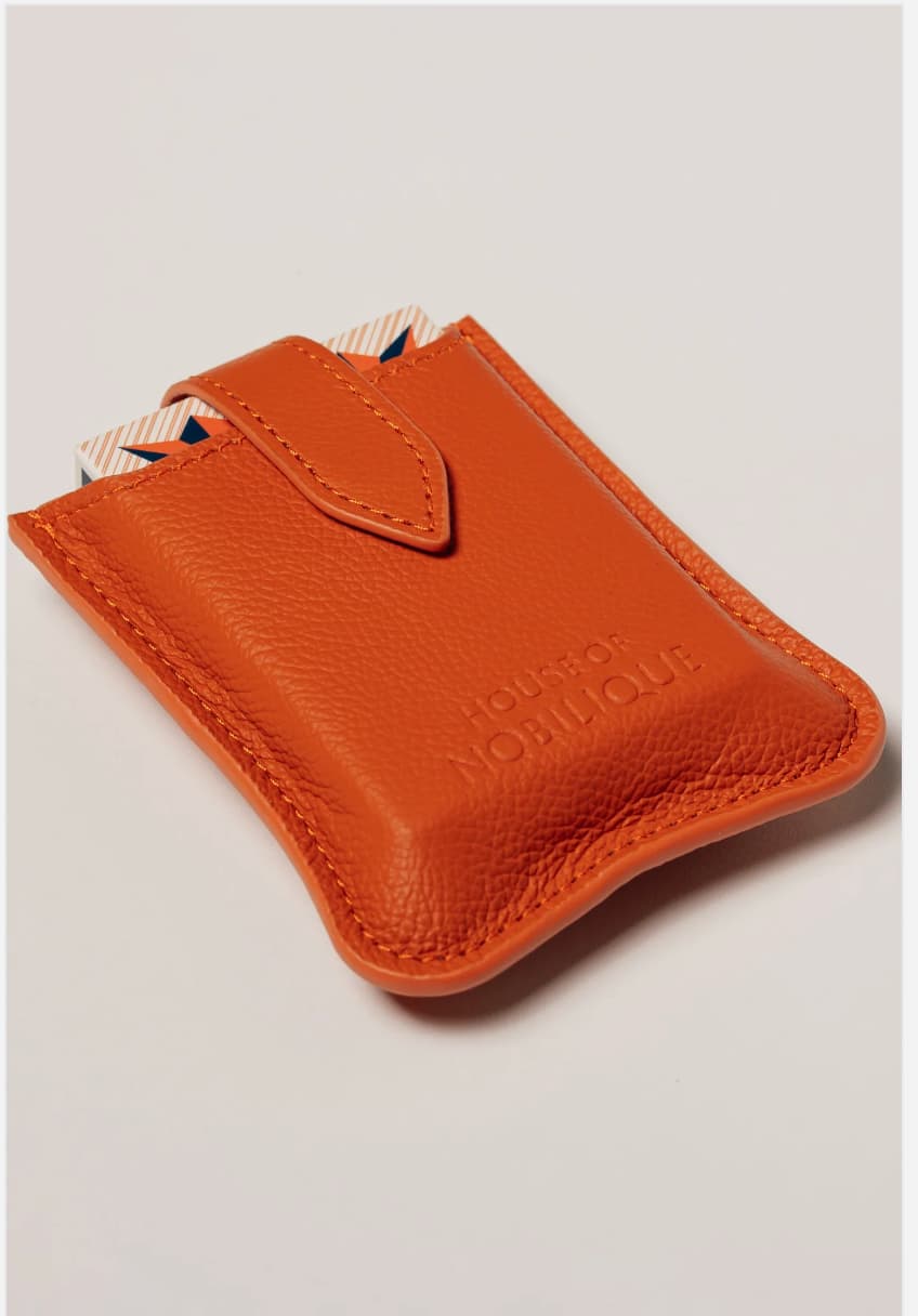 Orange leather travel playing cards set, a branded corporate gift designed for events, offsites and travel.