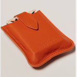 Orange leather travel playing cards set, a branded corporate gift designed for events, offsites and travel.