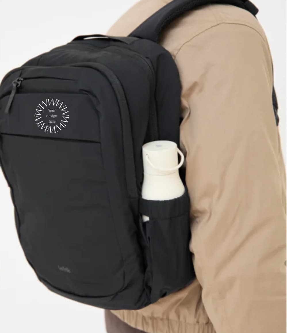 Lightweight Water Resistant Backpack 12L in black, worn on the back, showing logo placement