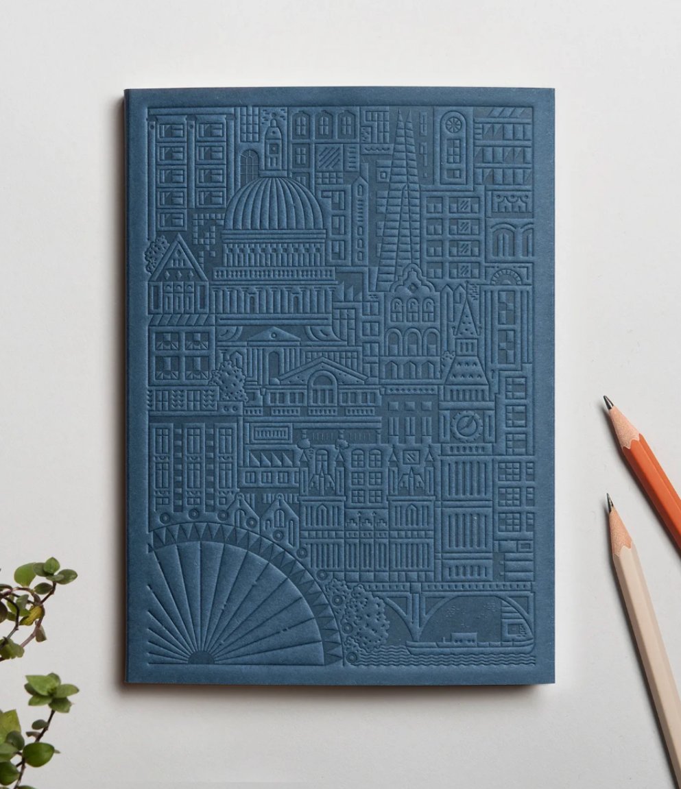 Debossed city of London notebook in blue, eco-friendly branded merchandise. Premium sustainable corporate gifts