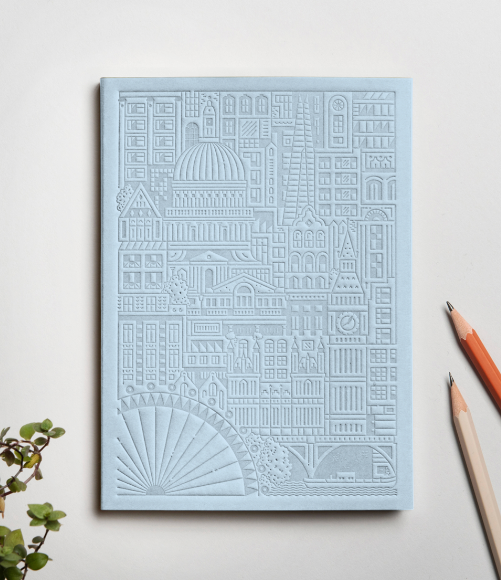 Debossed City of London notebook in sky blue. Sustainable Eco swag for events. Premium corporate gifts for women.
