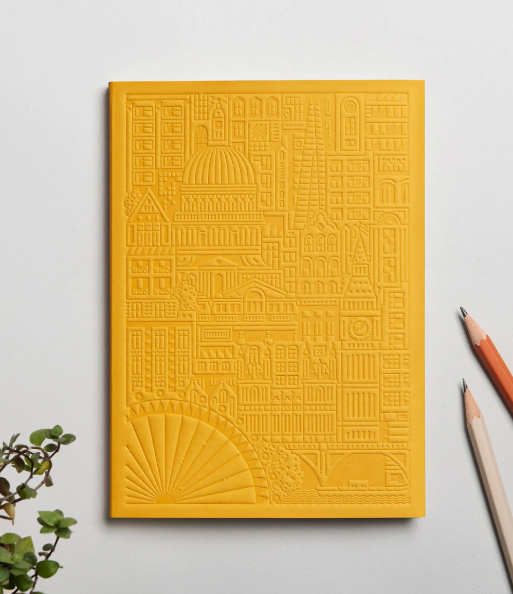 Debossed London notebook in yellow, branded sustainable merch and premium personalised corporate gifts