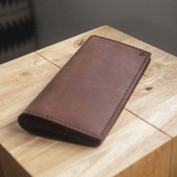 Vintage brown long wallet with compartments, ideal for branded gifts for clients with a social impact 