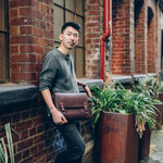 PETA-Approved vegan leather messenger bag offered, sustainable corporate gifts with impact