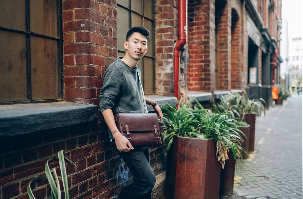 PETA-Approved vegan leather messenger bag offered, sustainable corporate gifts with impact