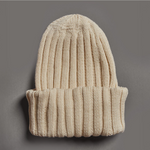 Beige merino wool beanie made from ethically sourced wool, hand knitted in Patagonia