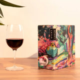 Merlot 2024, showing the Matisse-inspired box design alongside a glass of wine