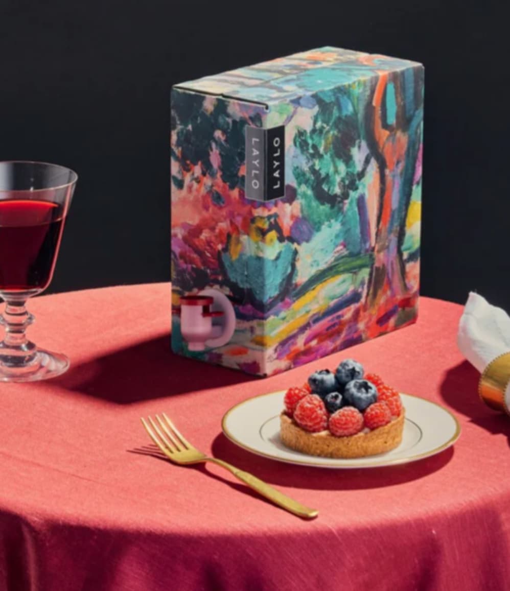 Merlot 2024, boxed with glasses of wine and a sweet treat