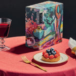 Merlot 2024, boxed with glasses of wine and a sweet treat