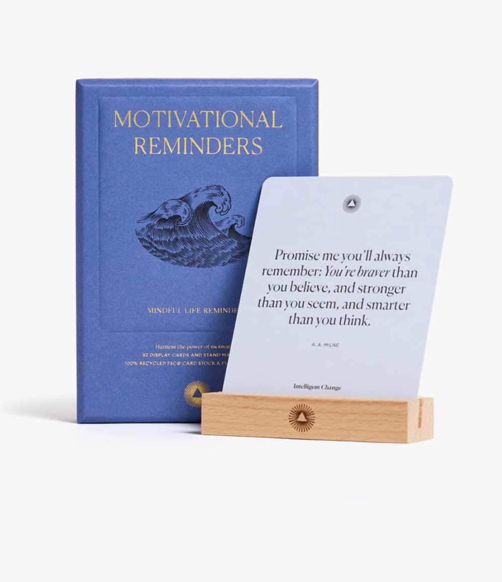 Motivational Reminders box beside a card displayed on the wood stand