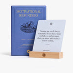 Motivational Reminders box beside a card displayed on the wood stand
