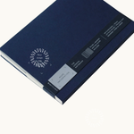 Back of blue notebook showing logo placement.