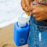 Reusable Glass Bottle 500ml in blue, showing logo placement