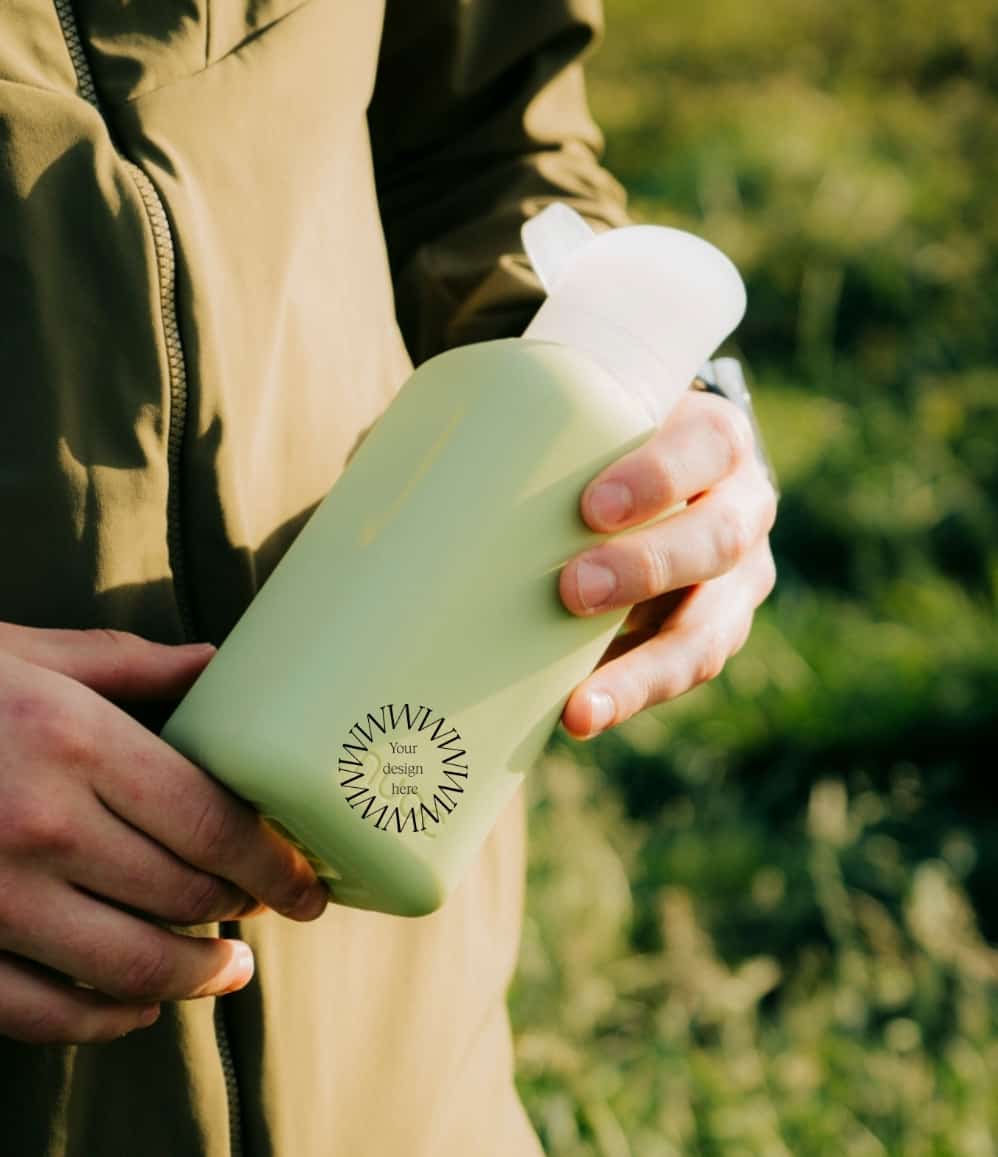 Reusable Glass Bottle 500ml in sage green, showing logo placement