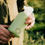Reusable Glass Bottle 500ml in sage green, showing logo placement
