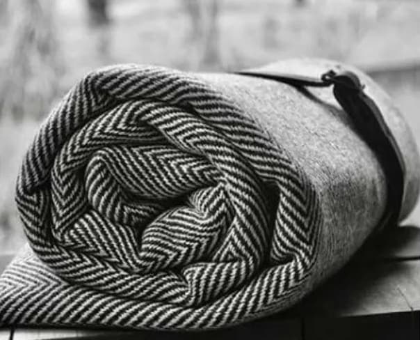 Handcrafted herringbone organic cotton throw, executive corporate gift from female artisans in Argentina