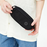 Oval Eco Pencil Case in black, held, showing logo placement