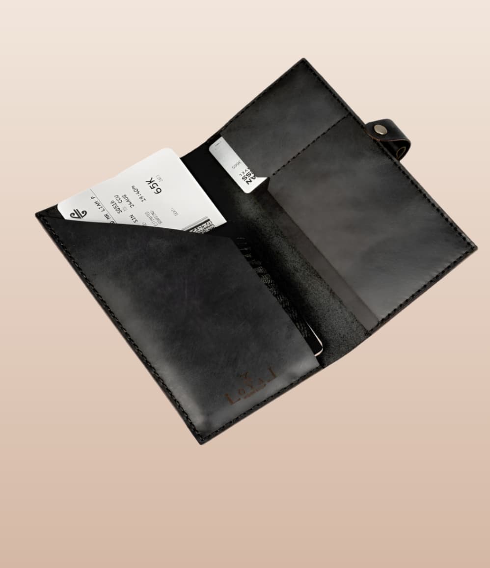 Black leather passport holder with card slot and document sleeve, an employee appreciation gift