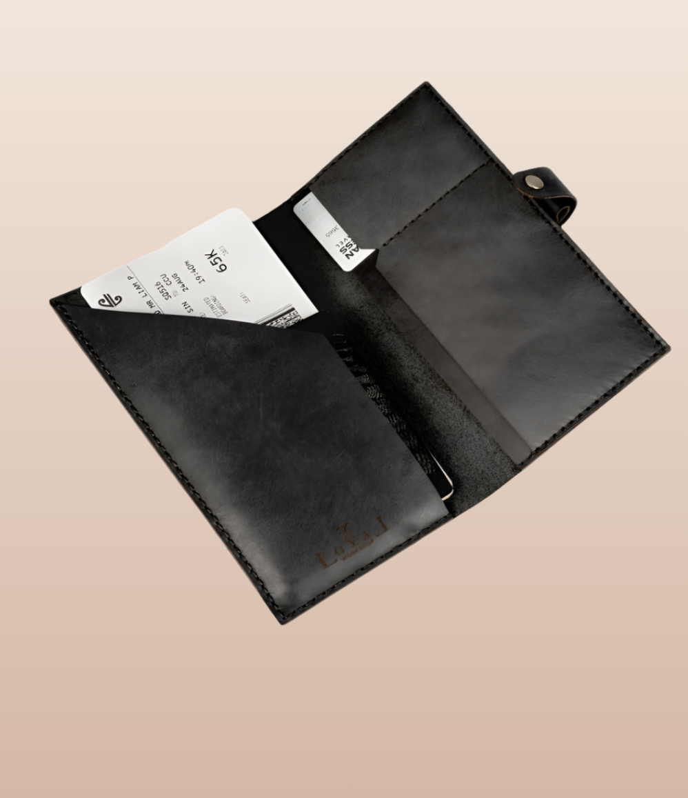 Black leather passport holder with card slot and document sleeve, an employee appreciation gift
