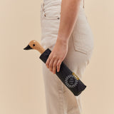 Personalised Black Duck Umbrella, being carried