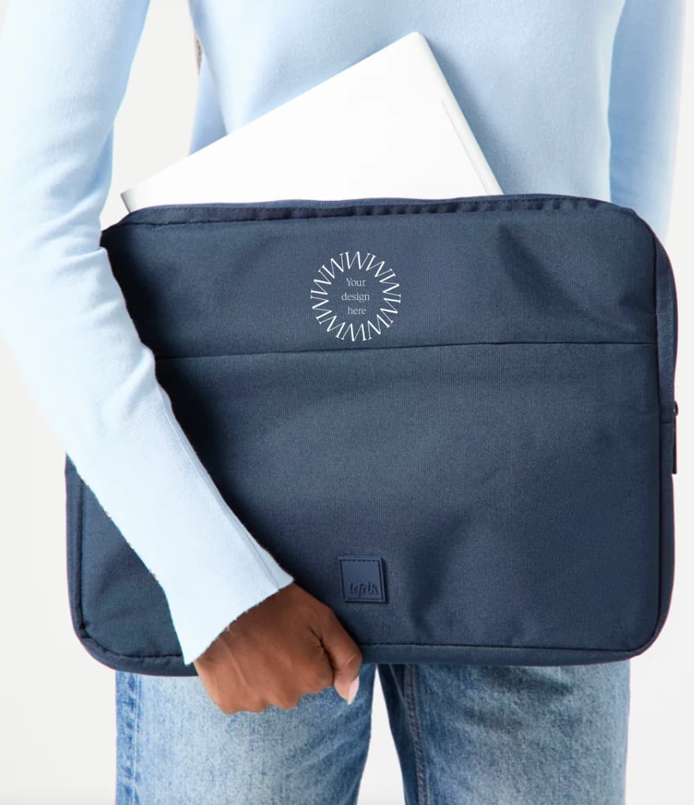 13" Laptop Sleeve in blue, being carried, showing logo placement