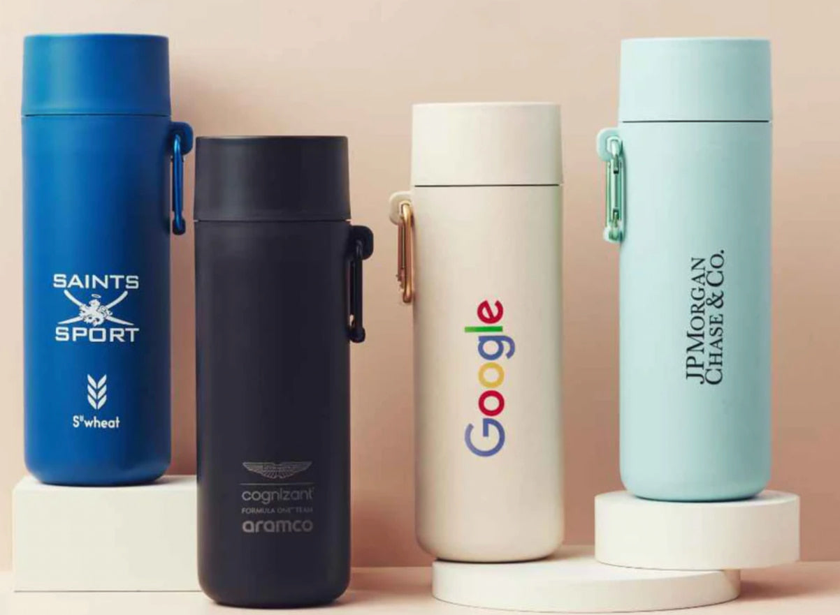 Plant Based Water Bottle, four bottles personalised with different company logos and brand colours