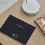 Productivity Daily Desk Pad for tracking goals, habits and wellbeing, sustainable wellness gift for employees and clients.