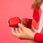 Red leather AirPods case for conference merchandise and large scale corporate events.