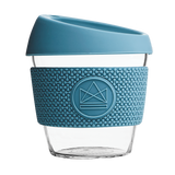 Blue reusable glass coffee cup with thermal sleeve, co-branded for premium merch