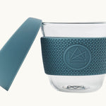 Blue reusable glass coffee cup with thermal sleeve, co-branded for eco swag