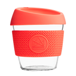 Orange reusable glass coffee cup with thermal sleeve, co-branded for premium merch
