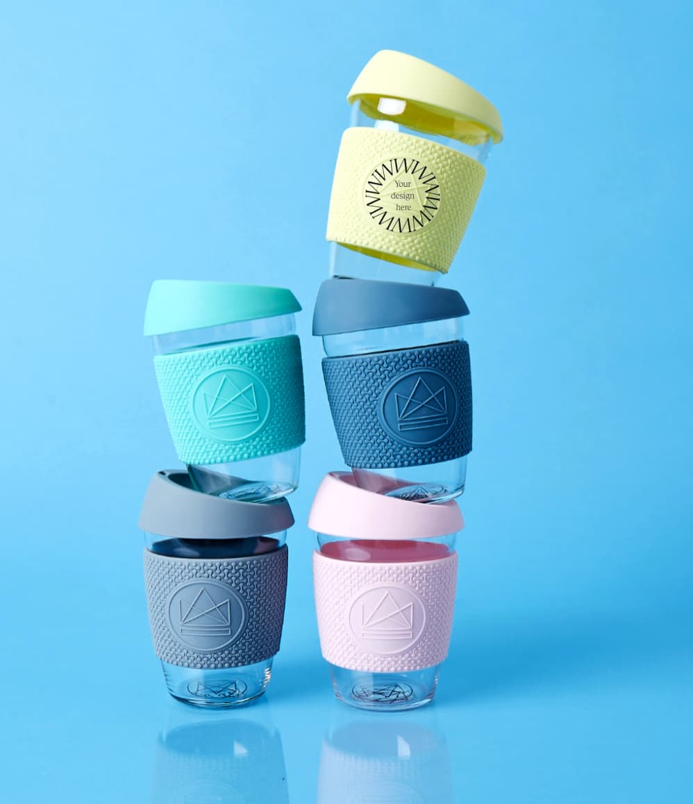 Reusable glass coffee cups in five colours with thermal sleeves, co-branded premium merch