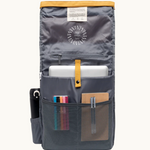 Vegan roll-top backpack in mustard, inside view with multiple internal pockets in waterproof recycled canvas for organised gadget storage. Sustainable branded merch