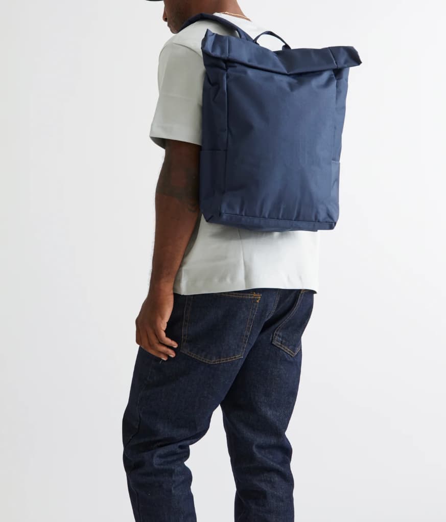 Vegan Roll-Top Backpack 21L in blue, worn