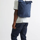 Vegan Roll-Top Backpack 21L in blue, worn