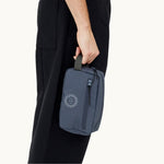 rPET Washbag in blue, being carried showing logo placement