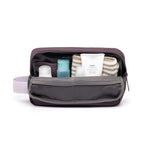 rPET Washbag in maroon, open, showing capacity and toiletries