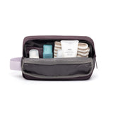 rPET Washbag in maroon, open, showing capacity and toiletries